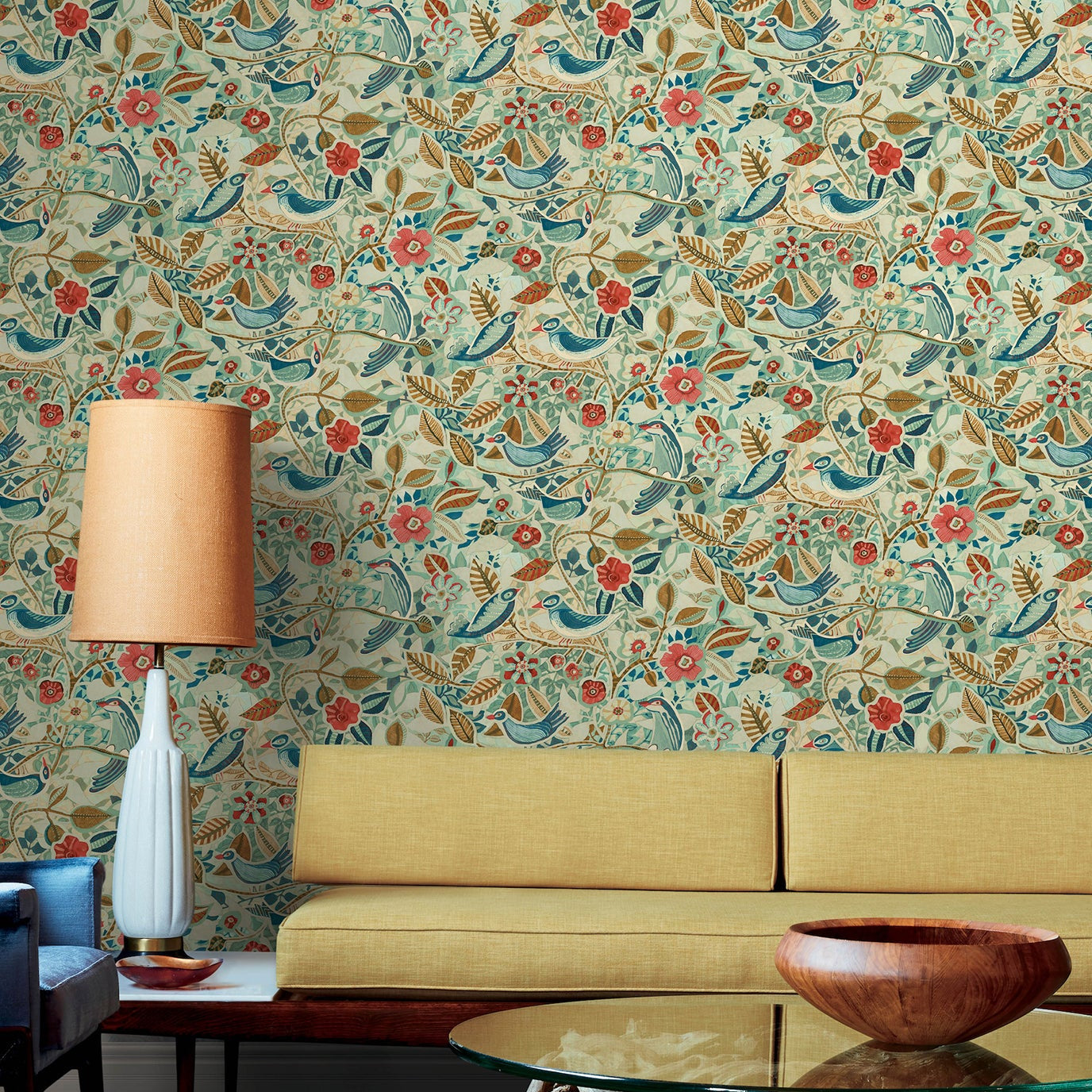 Living room with floral wallpaper, yellow sofa, and decorative elements.