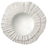 Round mirror with a decorative white frame on a white background