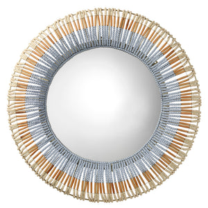 Round mirror with a decorative frame made of wooden sticks and beads on a white background