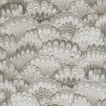 Patterned wallpaper with wavy, scalloped design in gray and white tones.