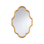 An ornate wall mirror with a scalloped, quatrefoil-like frame in a distressed gold finish, shown against a plain white background.