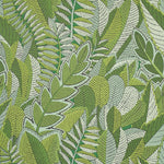 Pattern of green leaves on a textured wallpaper background
