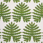 Tropical green leaves on a white performance fabric