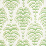 a green abstract botanical motif on white fabric 