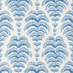 a blue abstract botanical motif on white fabric 