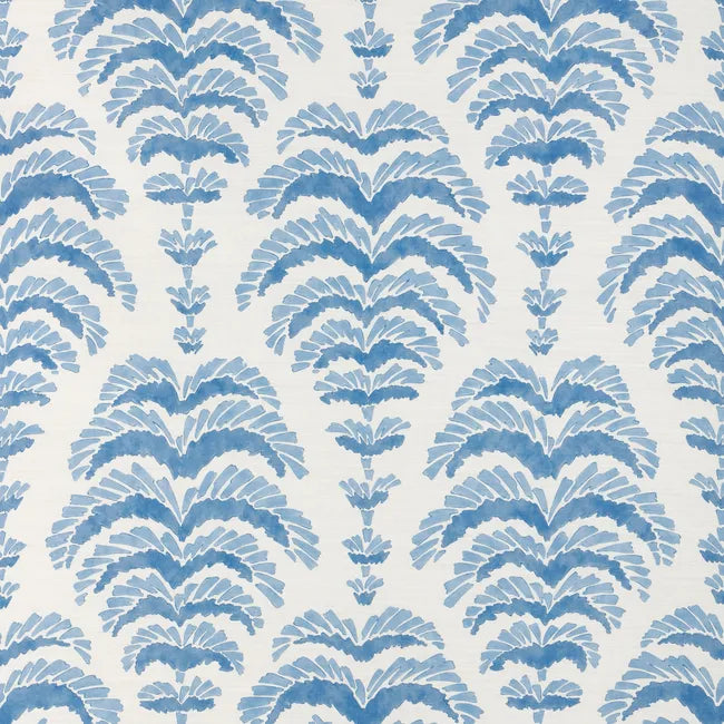 a blue abstract botanical motif on white fabric 