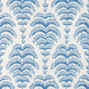 a blue abstract botanical motif on white fabric 