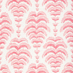 a pink abstract botanical motif on white fabric 