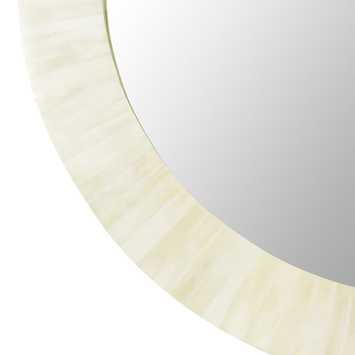 Round mirror with a beige frame on a white background