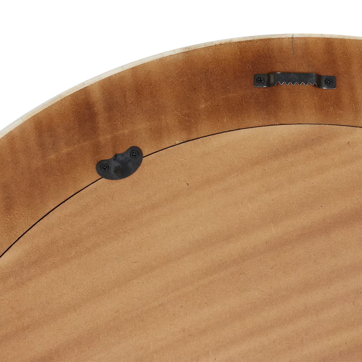 Close-up of aback of mirror with metal fixtures on a white background