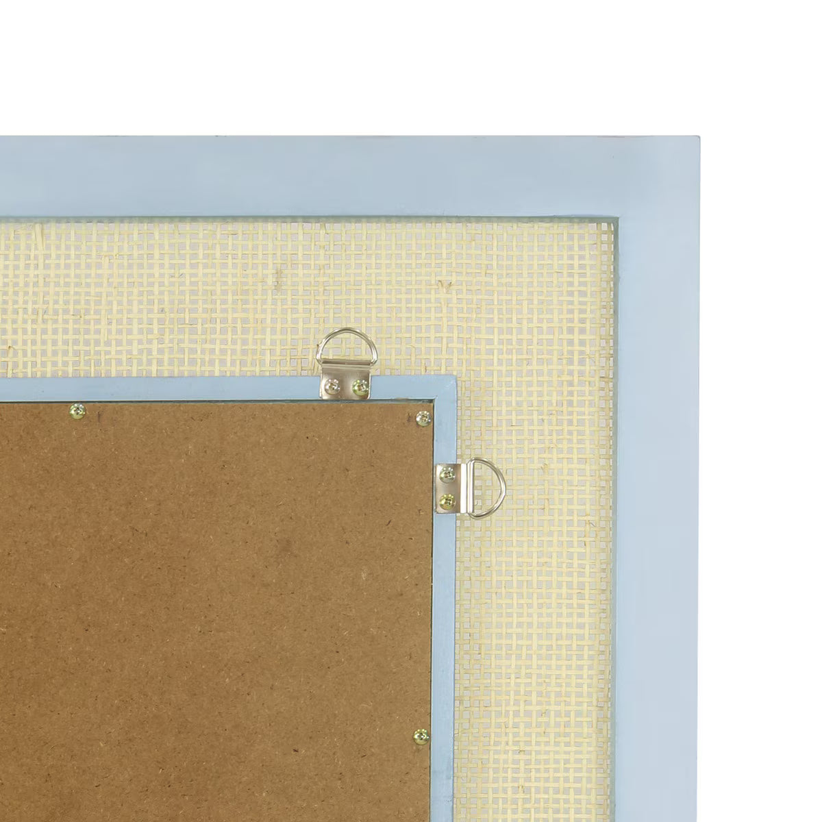 Close-up of the back corner of a mirror, showing a light blue frame, beige mesh backing, brown cork board, and metal hanging rings on a white background.