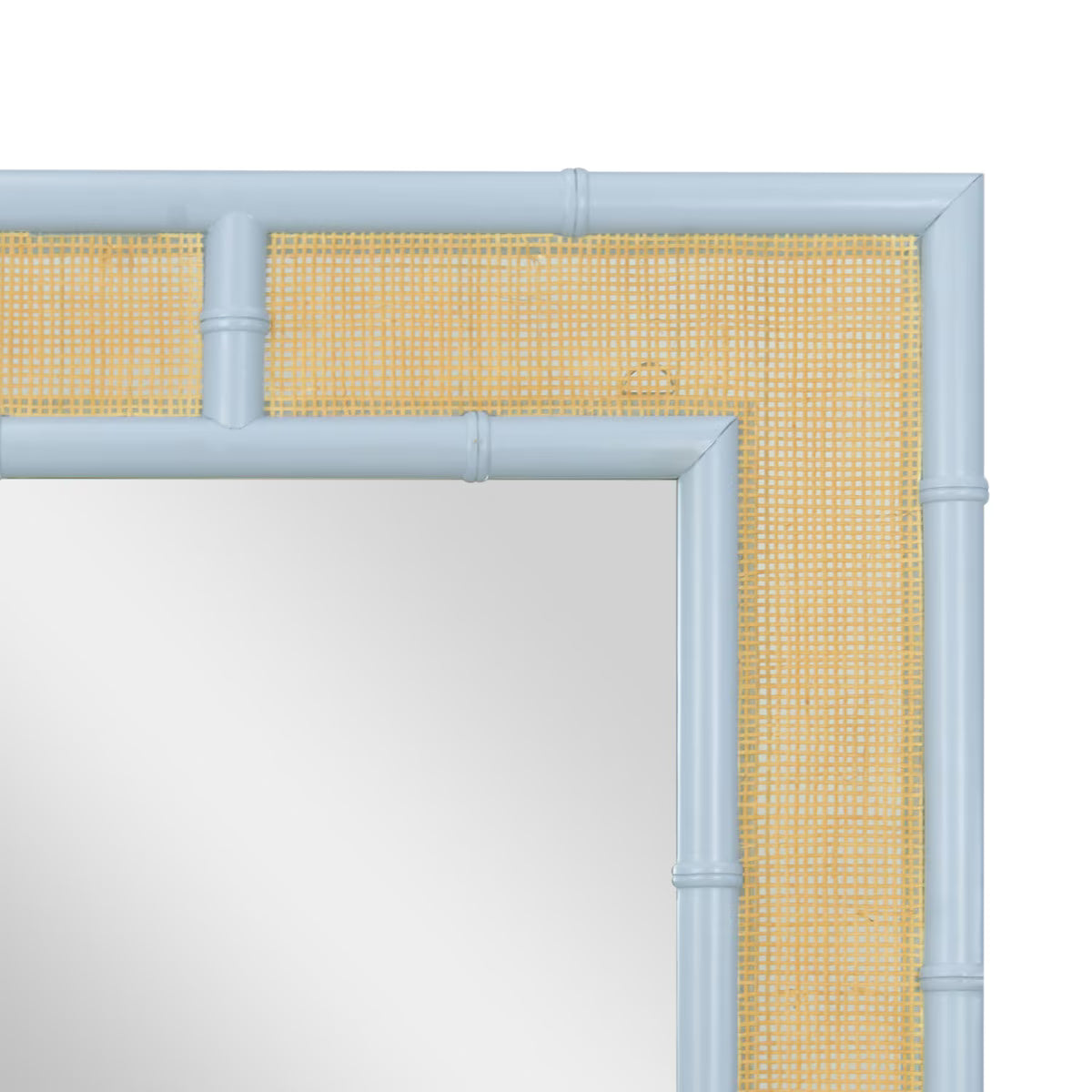 Close-up of a mirror frame corner with a pale blue bamboo-style frame and a woven yellow-and-white cane border, shown against a white background.