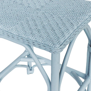 Close-up of a light blue wicker stool with a white background