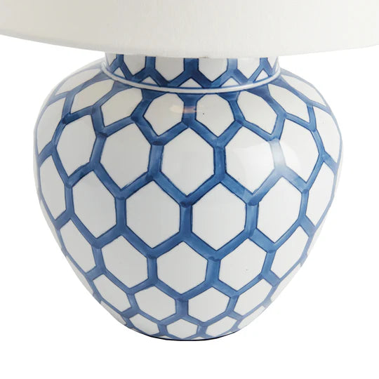 Ceramic lamp base with blue and white geometric pattern on a white background
