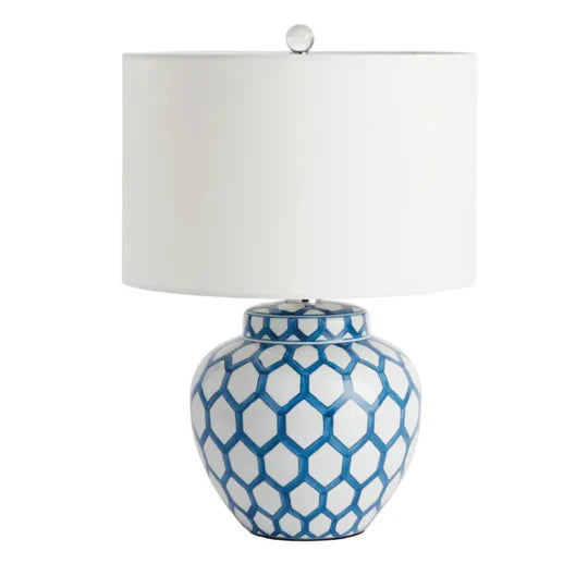 Table lamp with blue geometric pattern on a white background