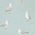 A wallpaper featuring a pattern of seagulls perching on sand, in a blue color.