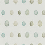 Pattern of speckled eggs on a light background