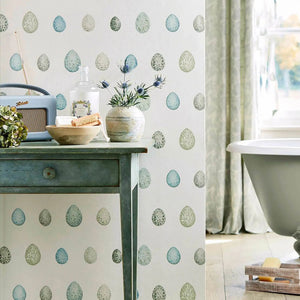Bathroom interior with a freestanding bathtub and decorative elements.