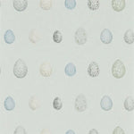 Pattern of speckled eggs on a light blue background