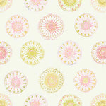 Pattern of pinks and citrus circular designs on a light background