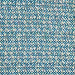 Patterned fabric with small blue circles on a beige background