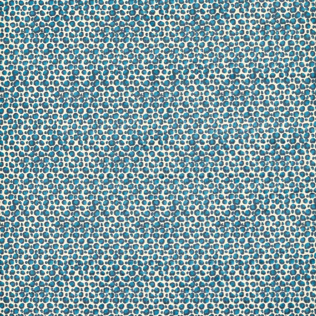 Patterned fabric with small blue circles on a beige background