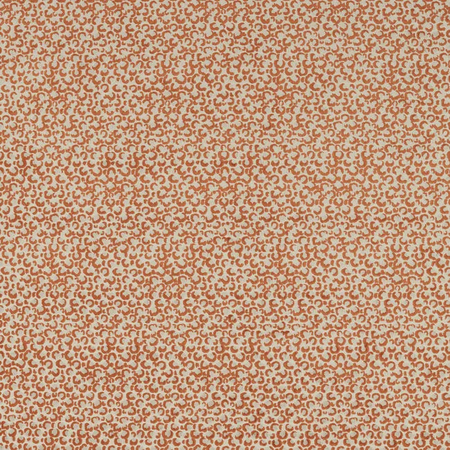 Patterned fabric swatch with a small, repetitive design in orange and beige.