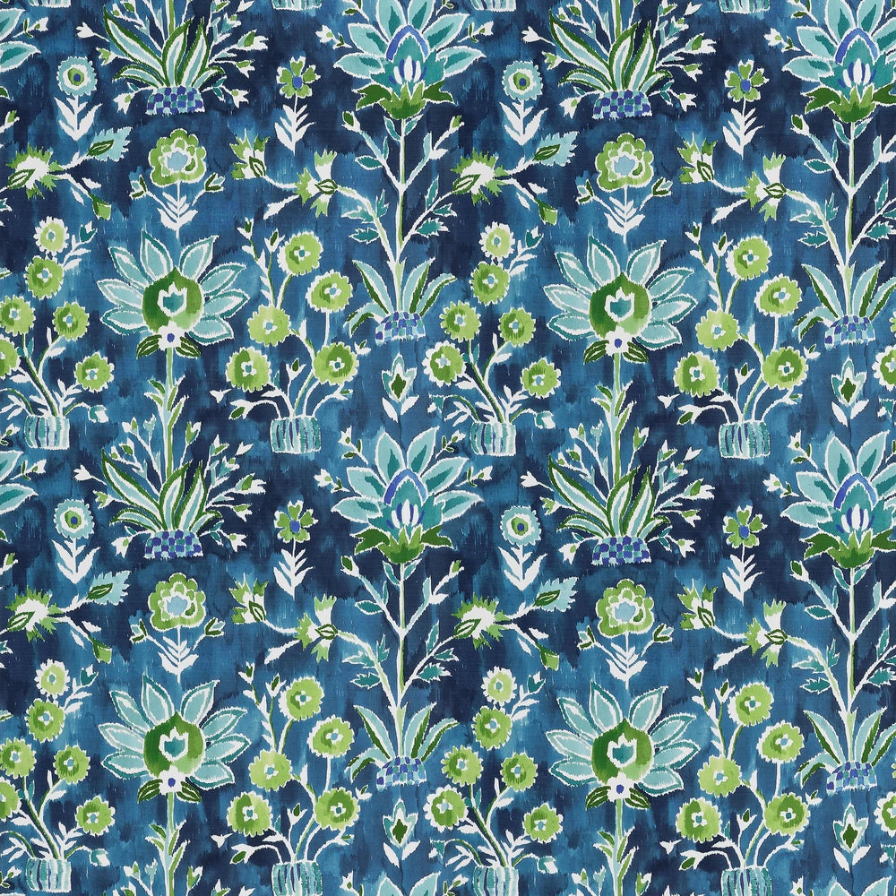 Patterned fabric with green floral design on a blue background
