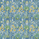 Patterned fabric with floral and plant designs on a blue background