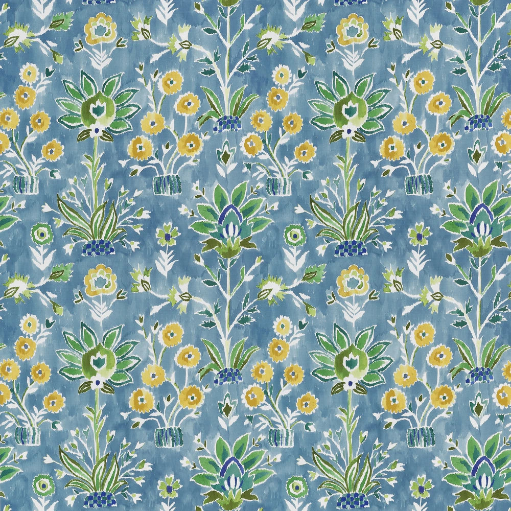Patterned fabric with floral and plant designs on a blue background