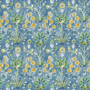 Patterned fabric with floral and plant designs on a blue background
