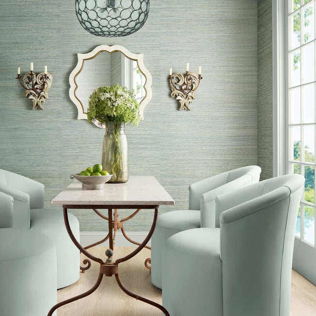 A sitting room featuring light aqua mineral grasscloth on the walls