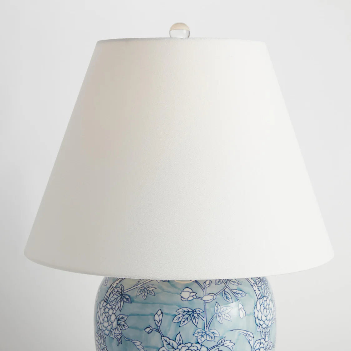 Lamp with floral design on a white background