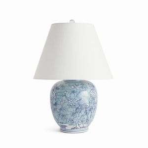 Decorative table lamp with blue floral patterns on a white background