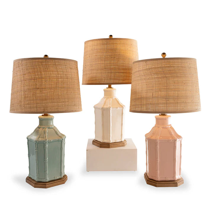 Three table lamps with woven lampshades on a white background