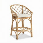 Wicker chair with a white cushion on a white background