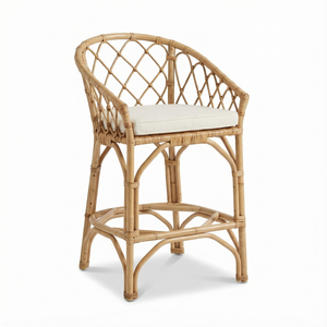 Wicker chair with a white cushion on a white background