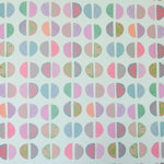 Patterned paper with colorful geometric shapes on a white background