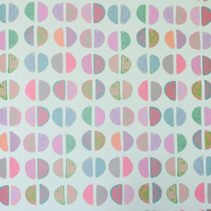 Patterned paper with colorful geometric shapes on a white background