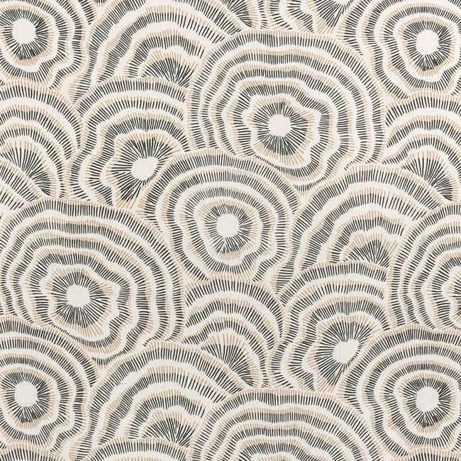 Patterned fabric with circular designs in beige and brown