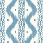 Blue and white geometric ikat pattern wallpaper swatch with vertical zigzag stripes and textured woven detailing.