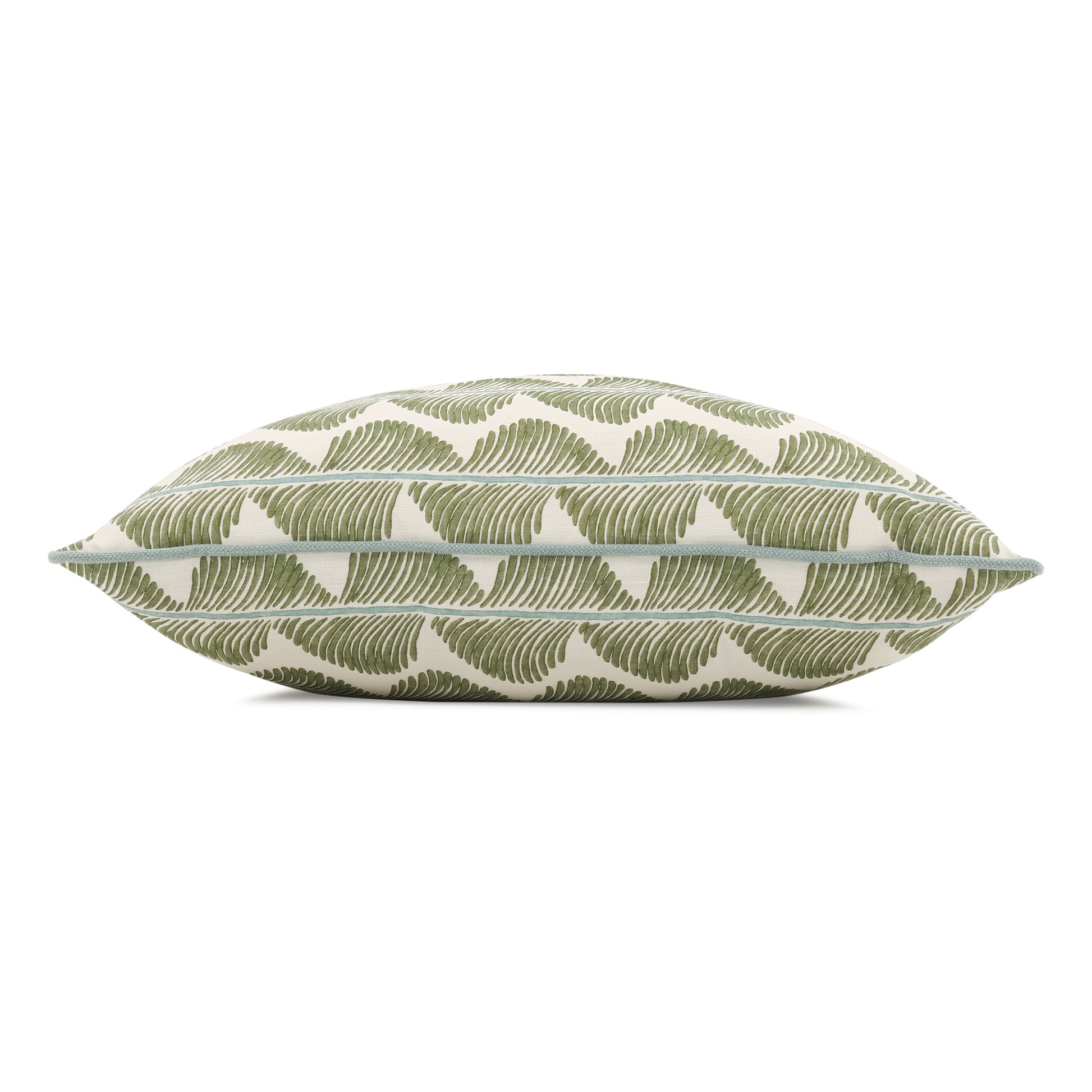 Decorative pillow with green leaf pattern on a white background