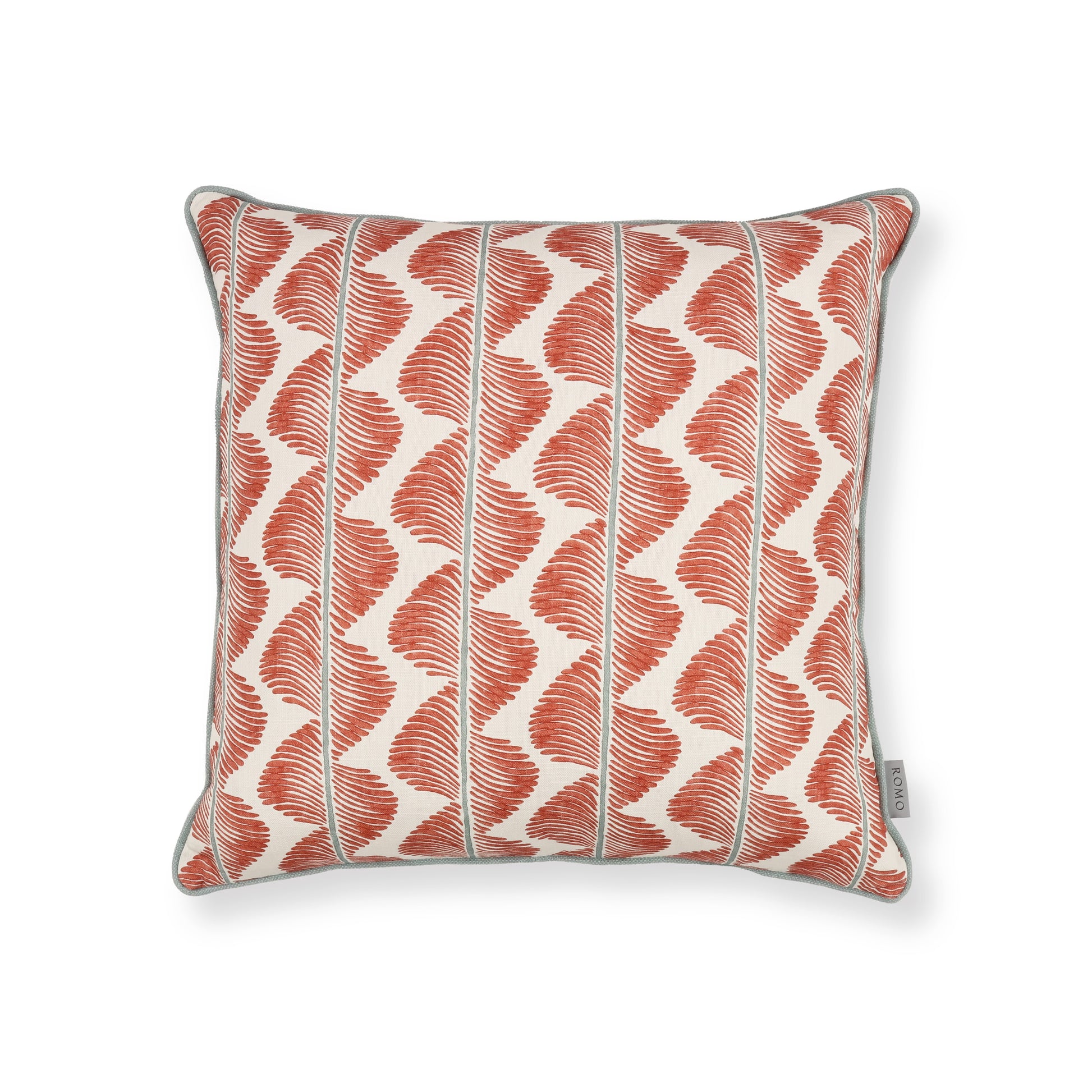 Decorative pillow with red and white pattern on a white background
