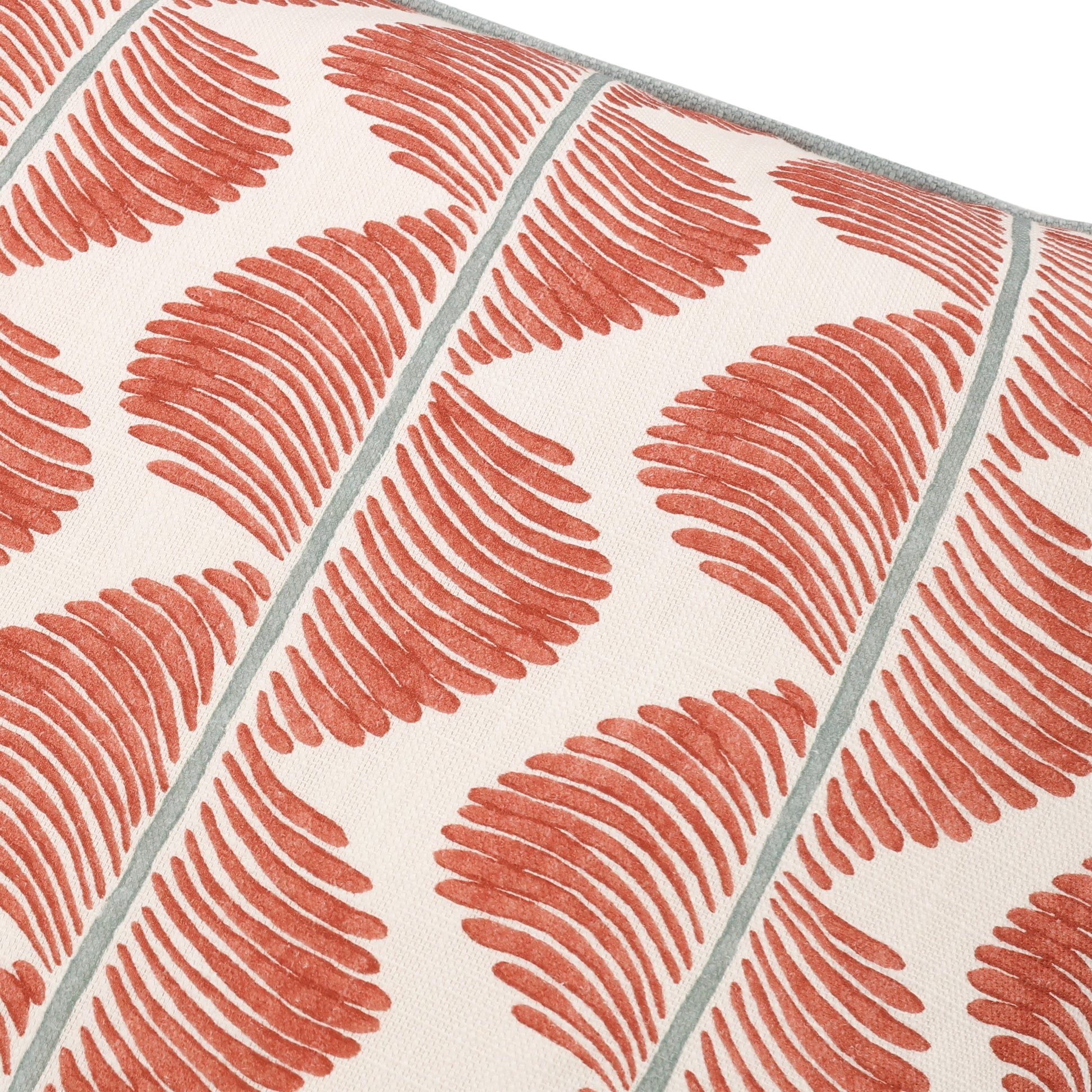Patterned fabric with red and gray design on a white background