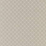 Patterned fabric swatch with a geometric design on a beige background