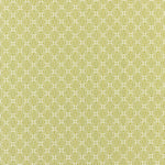 Patterned fabric swatch with a geometric design on a green background