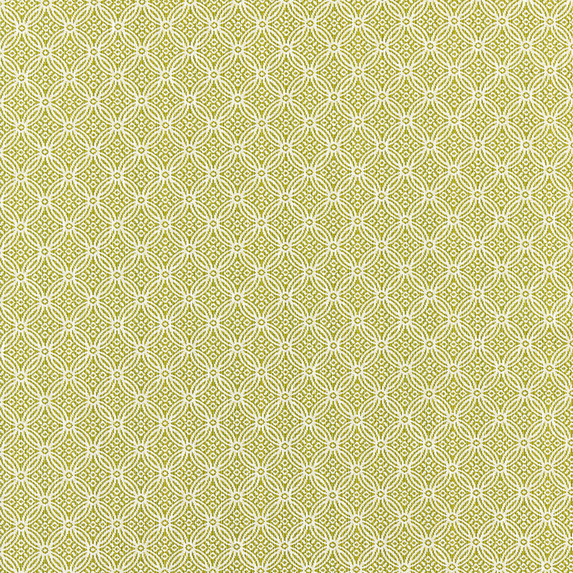 Patterned fabric swatch with a geometric design on a green background