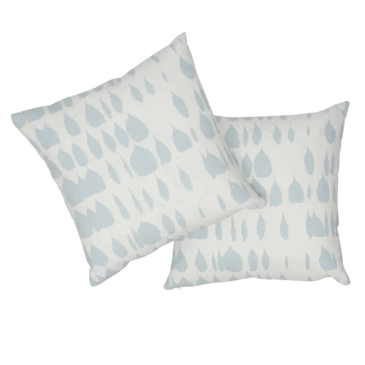 Two pillows with a light blue leaf pattern on a white background