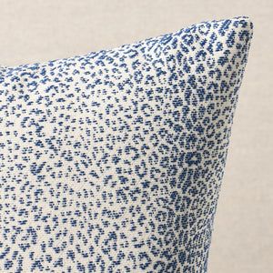 Blue and white patterned fabric on a beige background