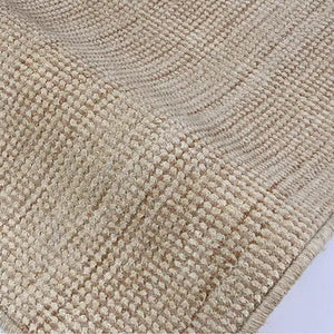 Close up of neutral textured rug 